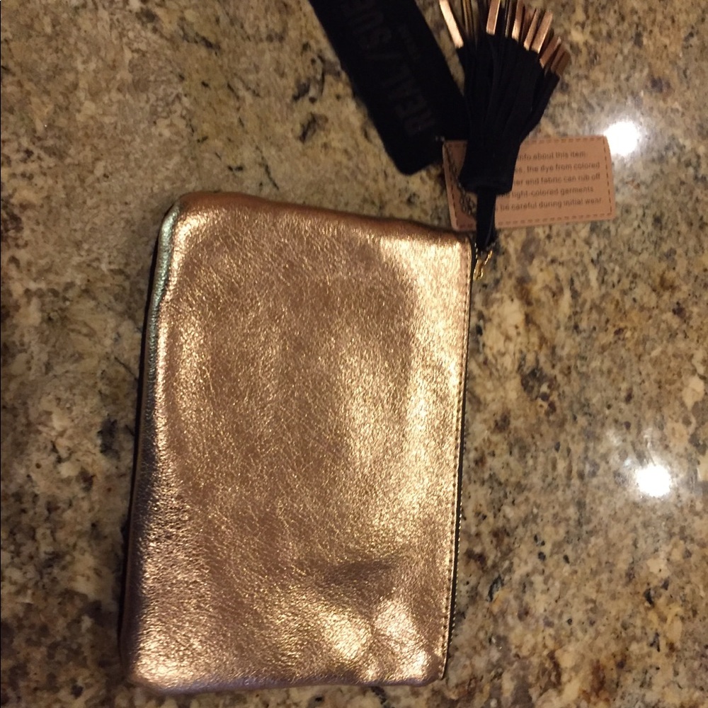 Shimmering gold and black suede leather bag